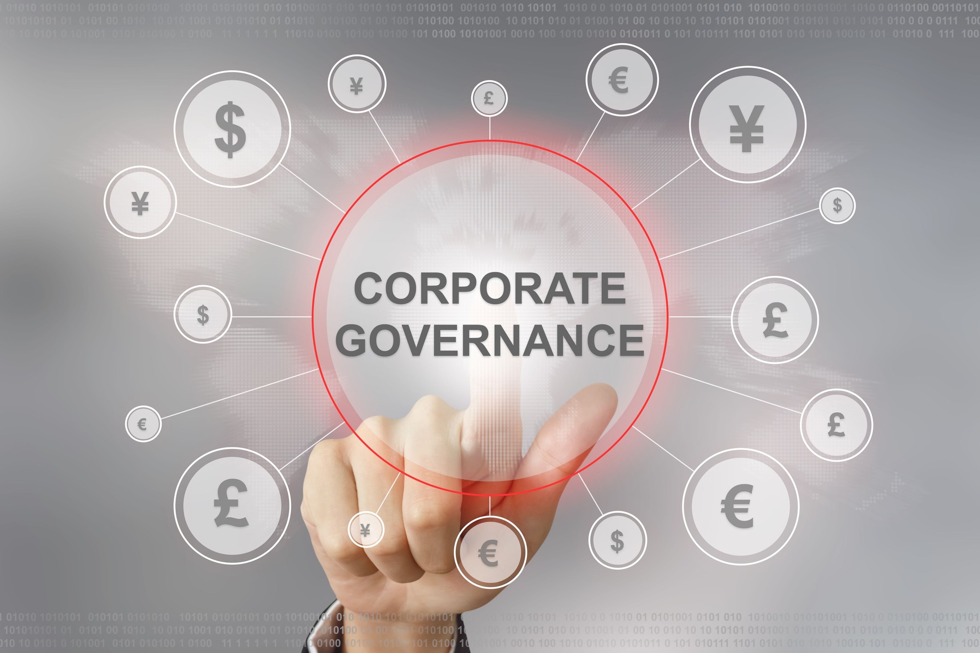 business hand pushing corporate governance button